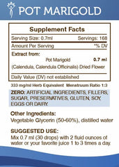 Secrets of the Tribe Calendula tincture drops on a spoon for gentle daily use.