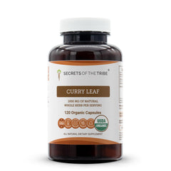 Secrets of the Tribe curry leaf capsules bottle on countertop, premium herbal supplement.