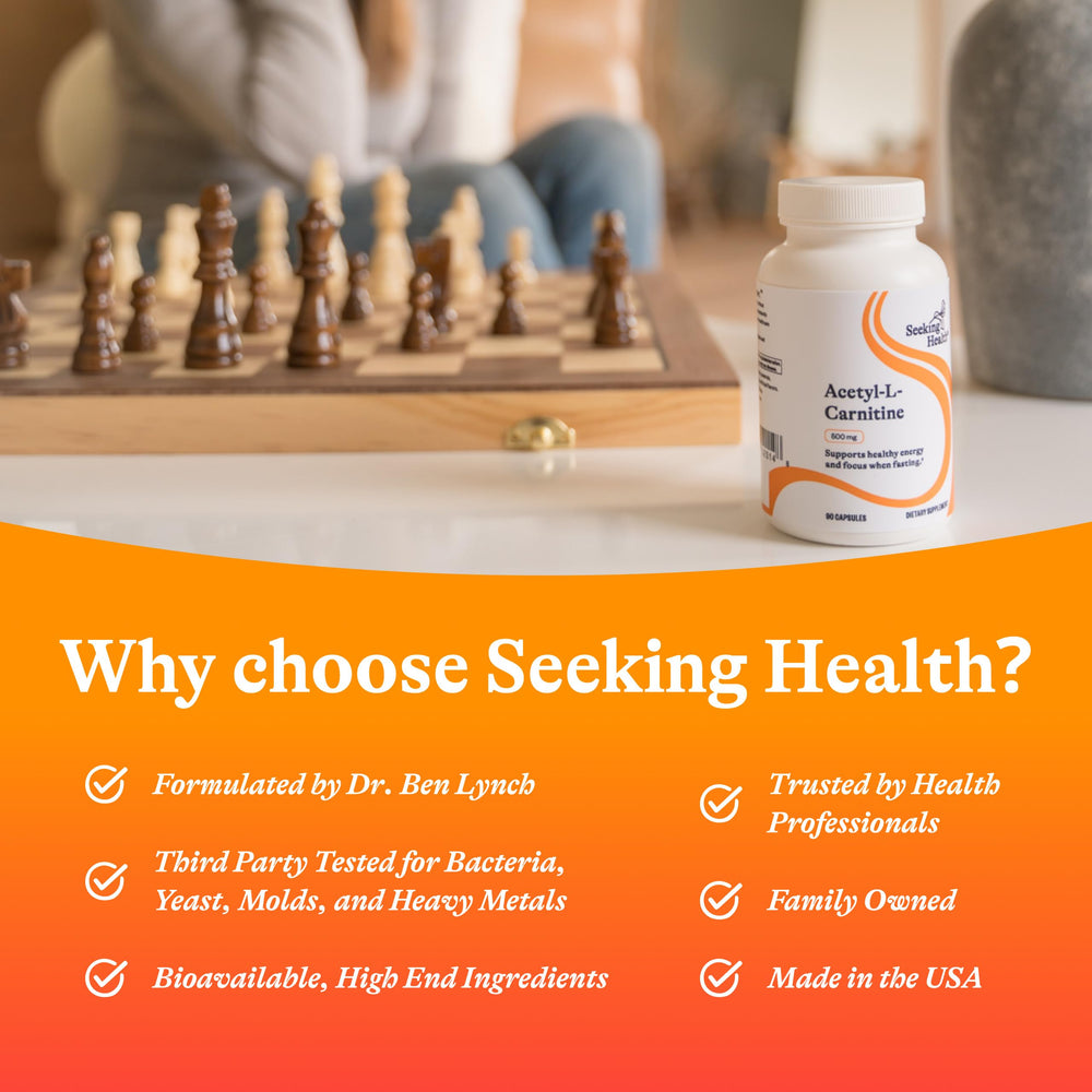 Seeking Health Acetyl-L-Carnitine bottle on desk; supports daily energy routine