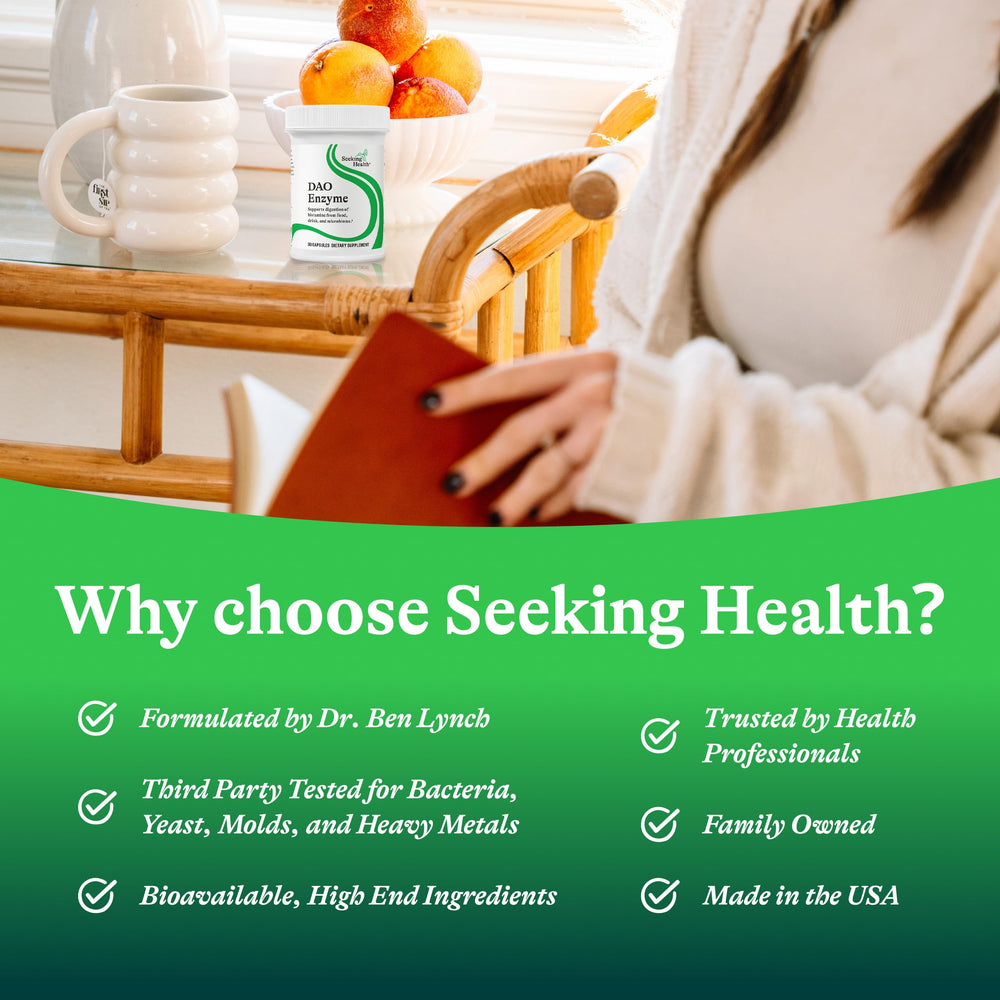 Seeking Health DAO Enzyme capsules arranged beside a plate signaling mealtime use.
