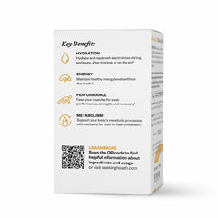 Athlete preparing an orange electrolyte drink from Seeking Health for workout recovery.
