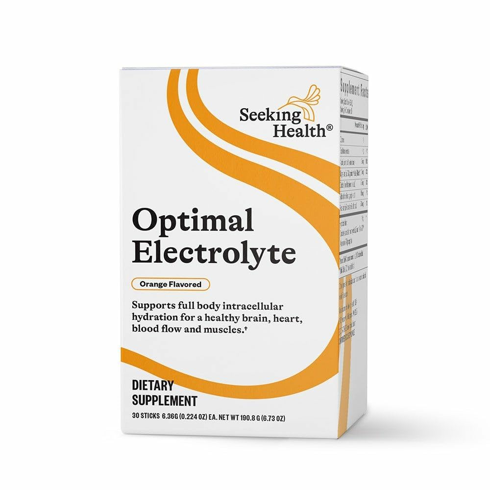 Seeking Health Optimal Electrolyte Sticks orange powder dissolving for post-workout hydration.