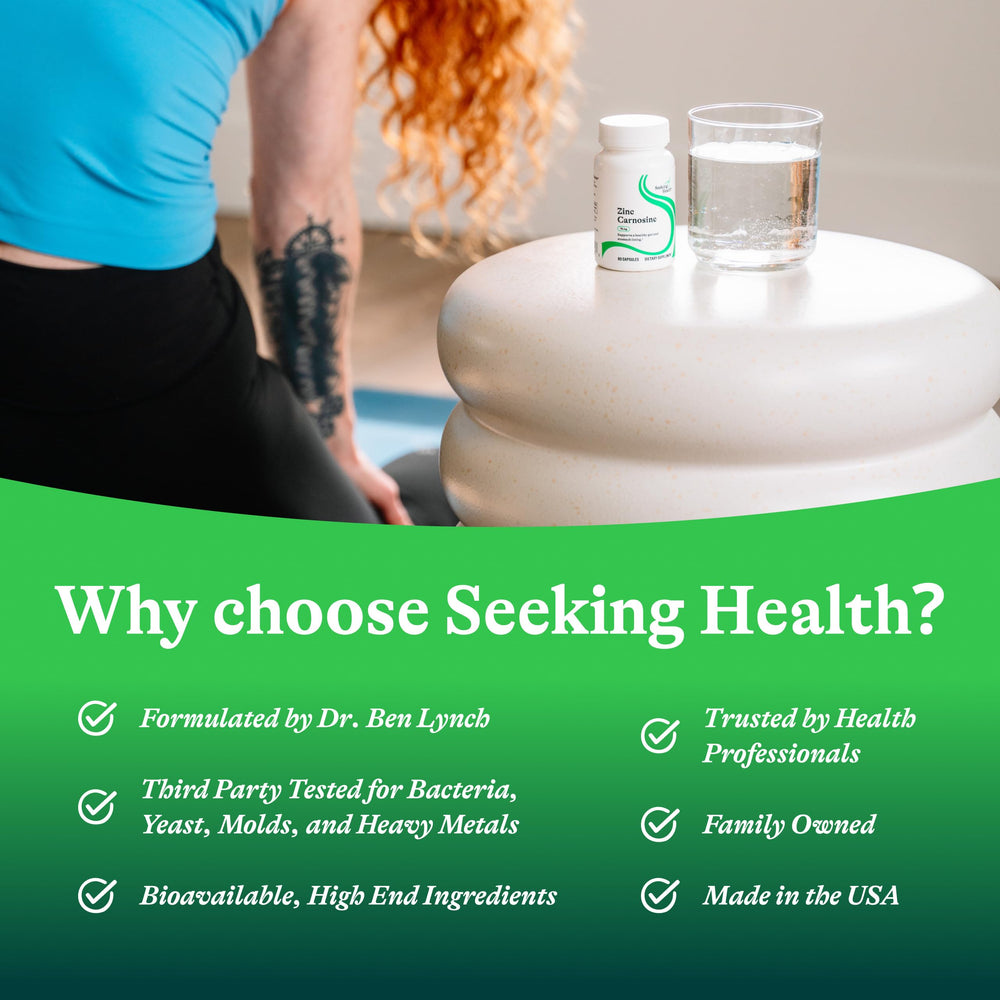 Seeking Health Zinc Carnosine bottle beside glass of water for hydration-friendly routine