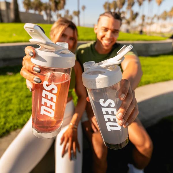 SEEQ Clear Whey Watermelon Wave scoop and sticks showcase convenient on-the-go protein serving.