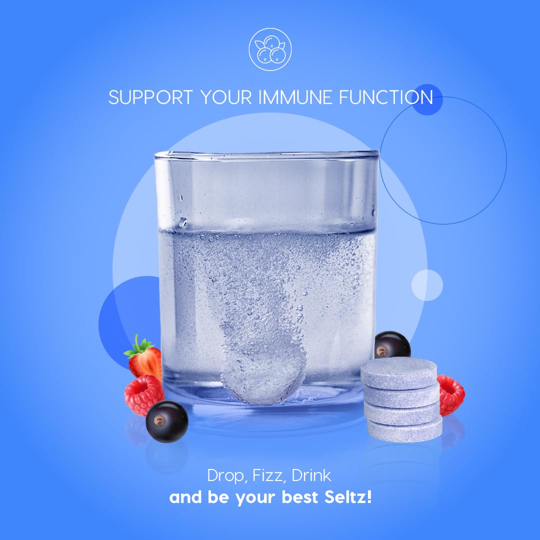 Seltz vitamin C and zinc fizzing in water.