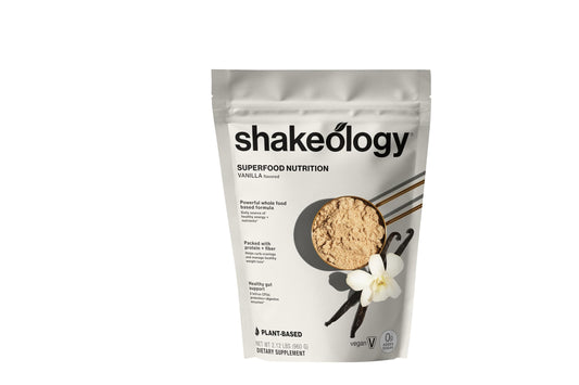 Shakeology Vanilla plant-based protein powder bottle highlights gluten-free nutrition.