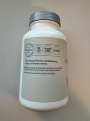 Shaklee Cholesterol Complex pills with glass shows easy daily supplementation opportunity
