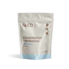 Shed Nutrition Clear Protein Blue Razz poured into glass for quick hydration.