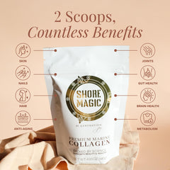 Scoop of Shore Magic collagen powder beside a glass of water.