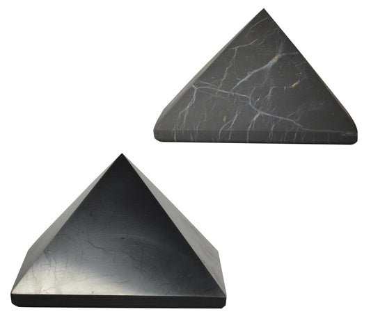 Shungite World polished pyramid on a desk for focused energy
