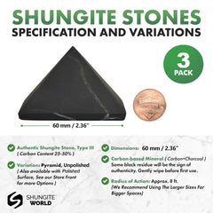 Shungite World unpolished 60mm pyramid beside a laptop for energy balance