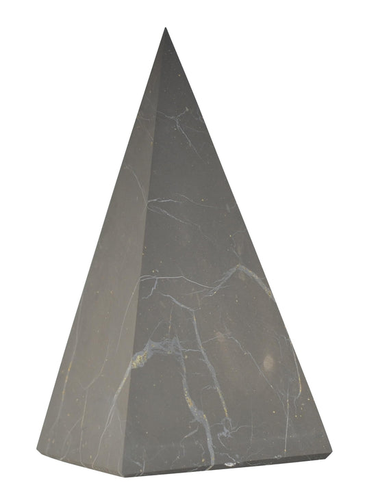 Shungite World authentic tall pyramid 70mm on desk for protective energy balance.