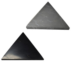 Shungite World polished pyramid 100 mm sits on an office desk for energy balance.