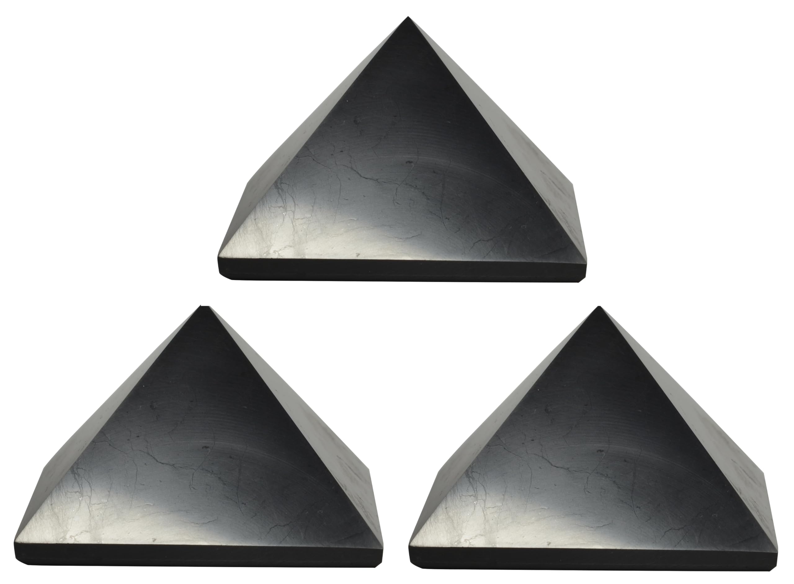 Shungite World 70mm pyramid closeup on desk for calm ambience.