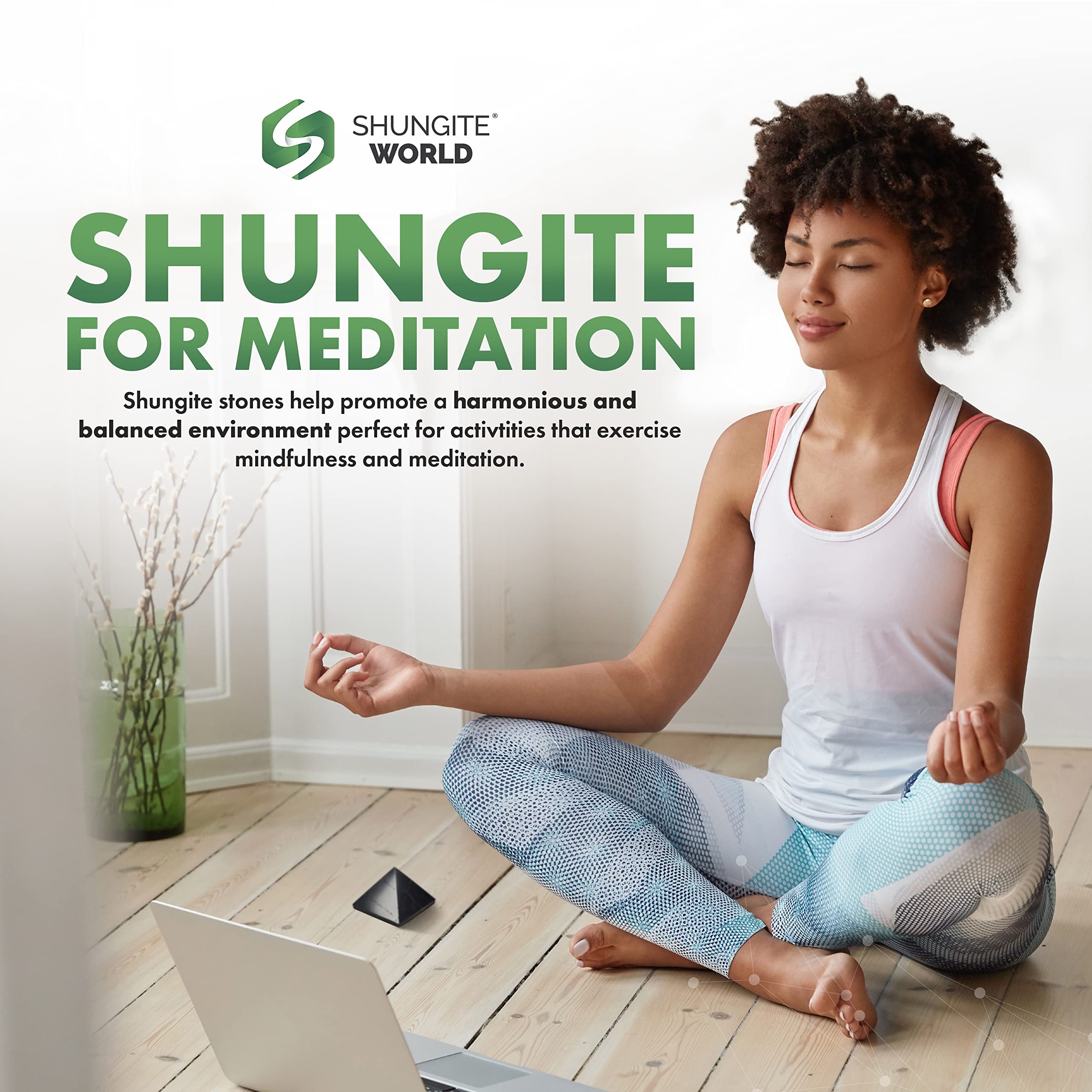 Shungite World pyramid paired with crystals creates a Zen-inspired display.