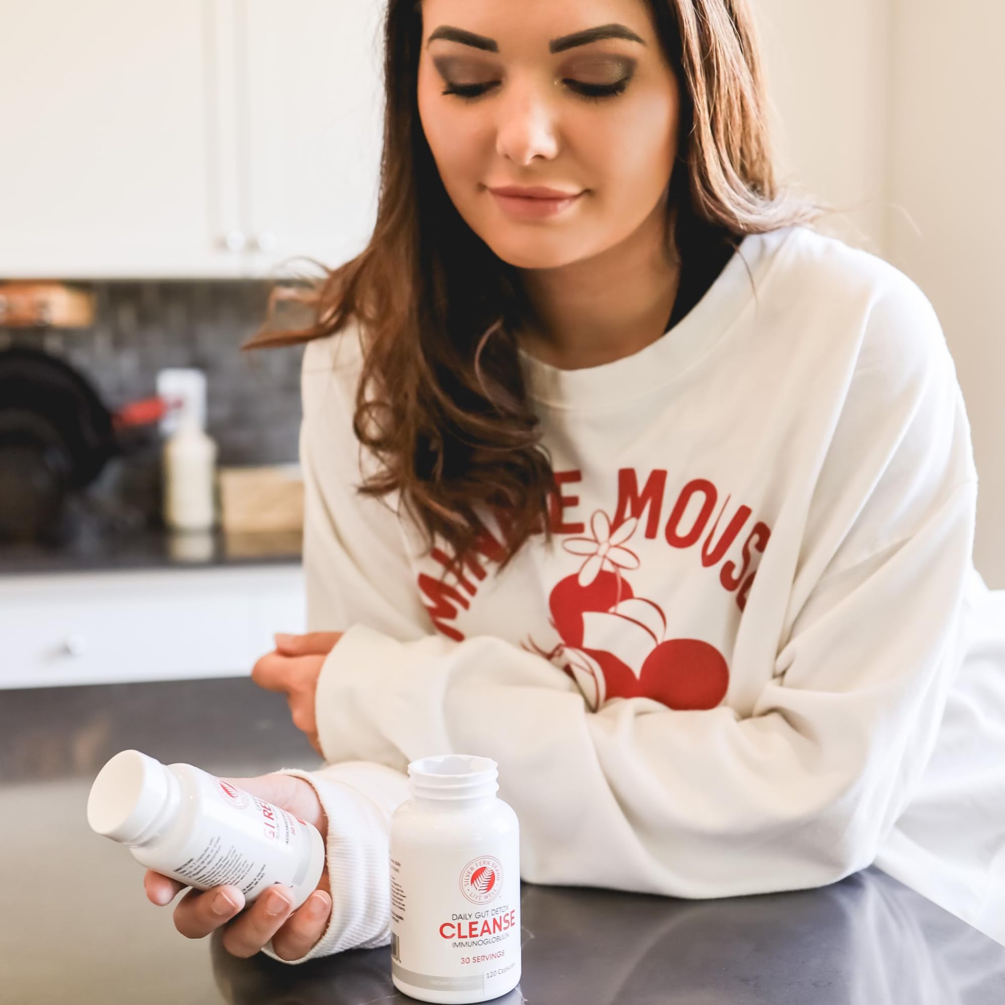Pouring capsules into a dish illustrates a simple daily ritual