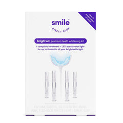 SmileDirectClub teeth whitening kit with LED light for at-home whitening using four gel pens.