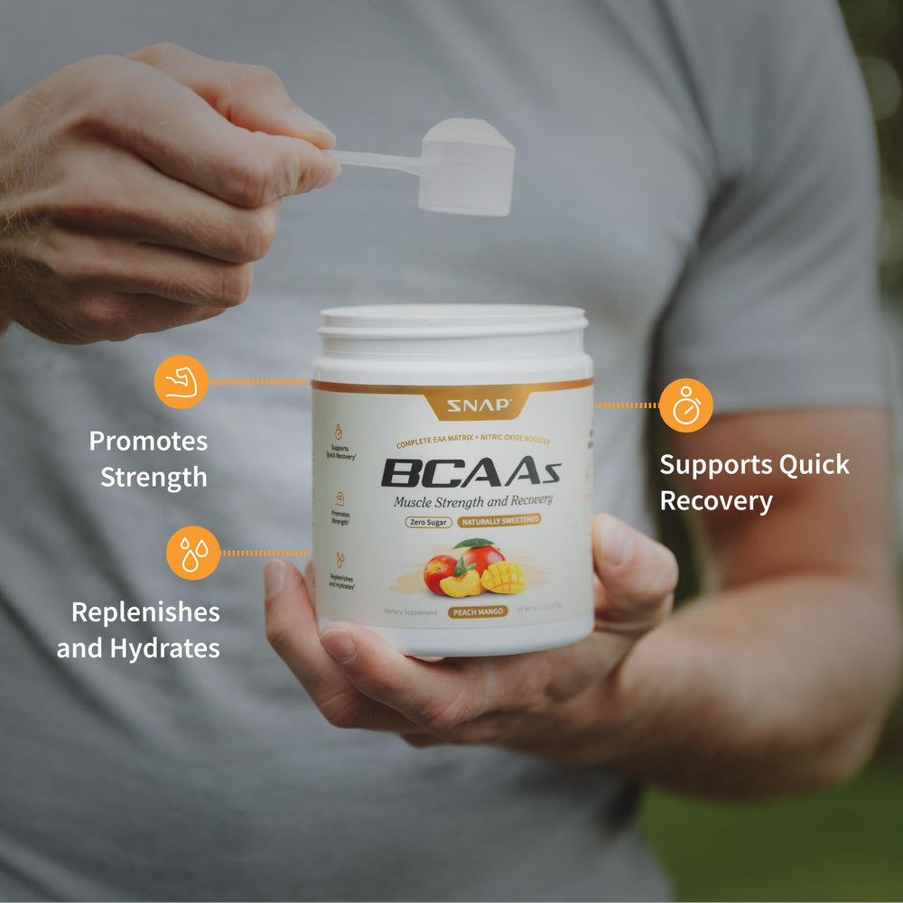 Snap Supplements BCAA Powder glass with peach mango drink