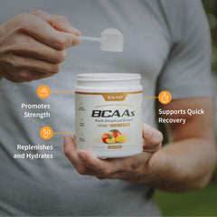 Snap Supplements BCAA Powder glass with peach mango drink