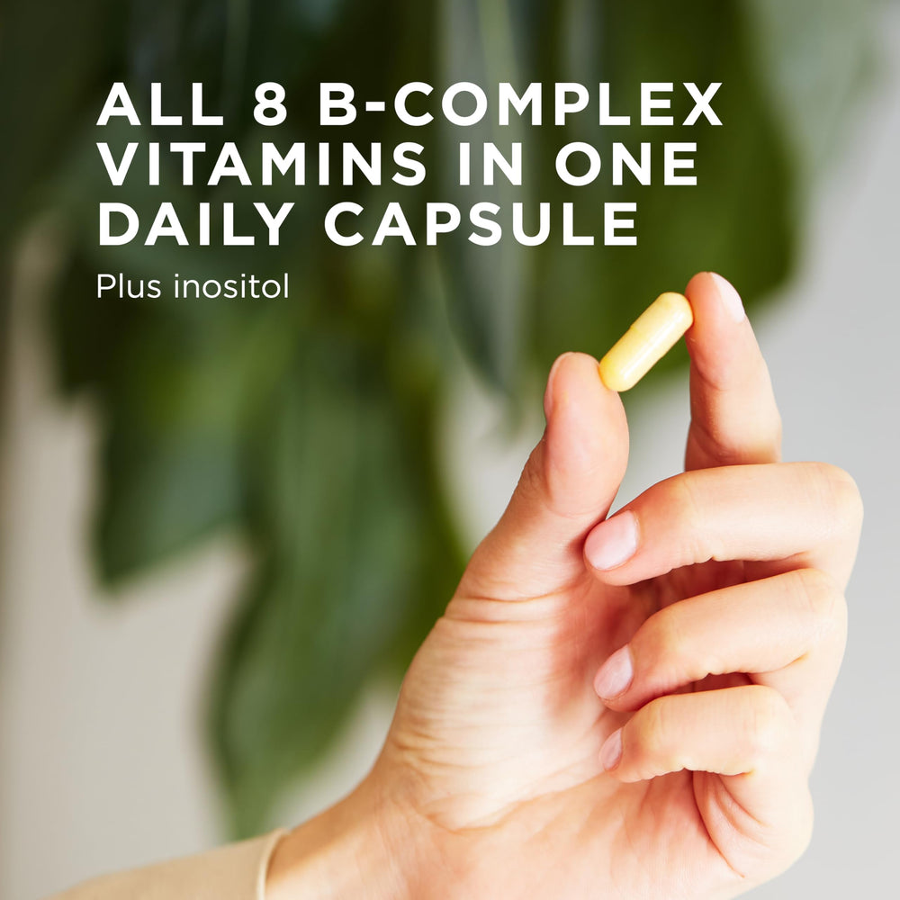 Solgar B-Complex 100 capsules on spoon show easy daily supplement