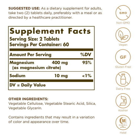 Solgar Magnesium Citrate tablets close-up showing small, easy-to-swallow shape.