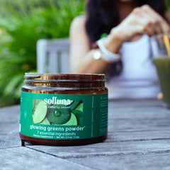 Solluna Greens label closeup displaying vegan formula and key nutrients.