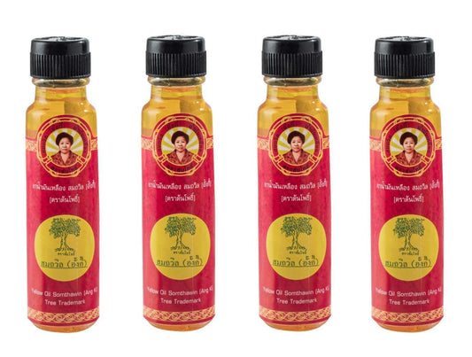 Somthawin Angki yellow oil bottle closeup for fast-warming Muay Thai prep