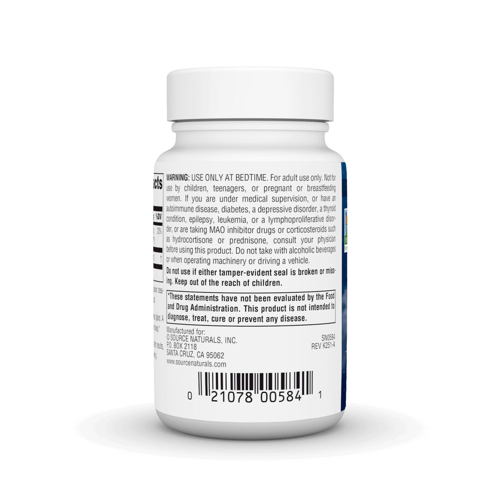 Source Naturals Melatonin lozenges on nightstand beside glass of water