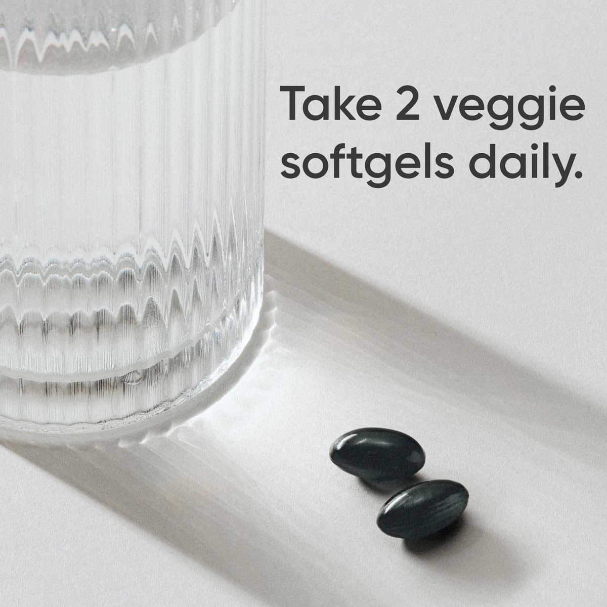 Bottle label indicates vegan-friendly, gluten-free, and non-GMO formulation.