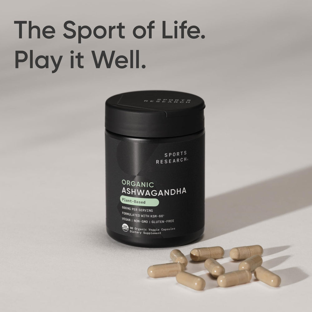 Vegan-certified Sports Research capsules beside water for evening use.