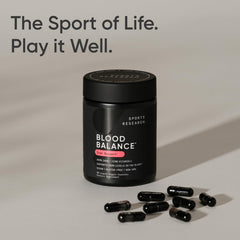 A user takes a Blood Balance capsule as part of a daily wellness routine.