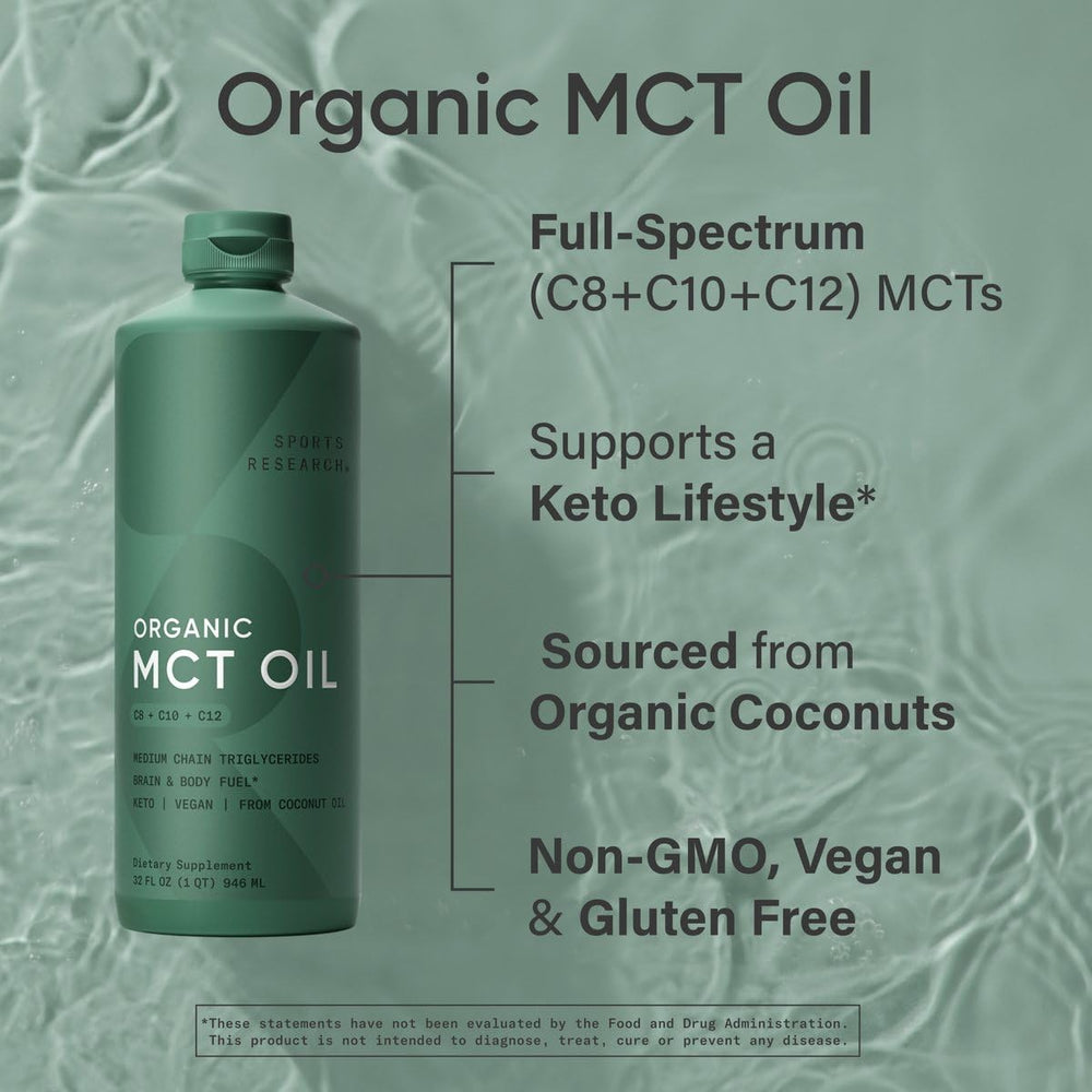 Organic coconuts and a Sports Research MCT Oil bottle on a wooden surface.