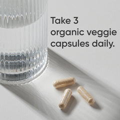Sports Research Organic Lion's Mane capsules close-up highlighting vegan, non-GMO formula.