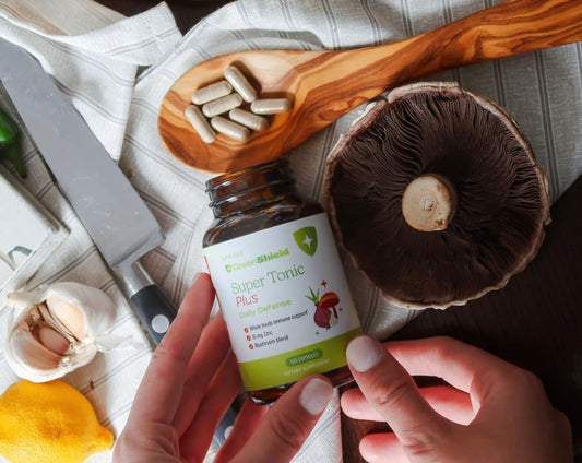 Close-up of SPRIGS Super Tonic Plus capsules ready to take with meals