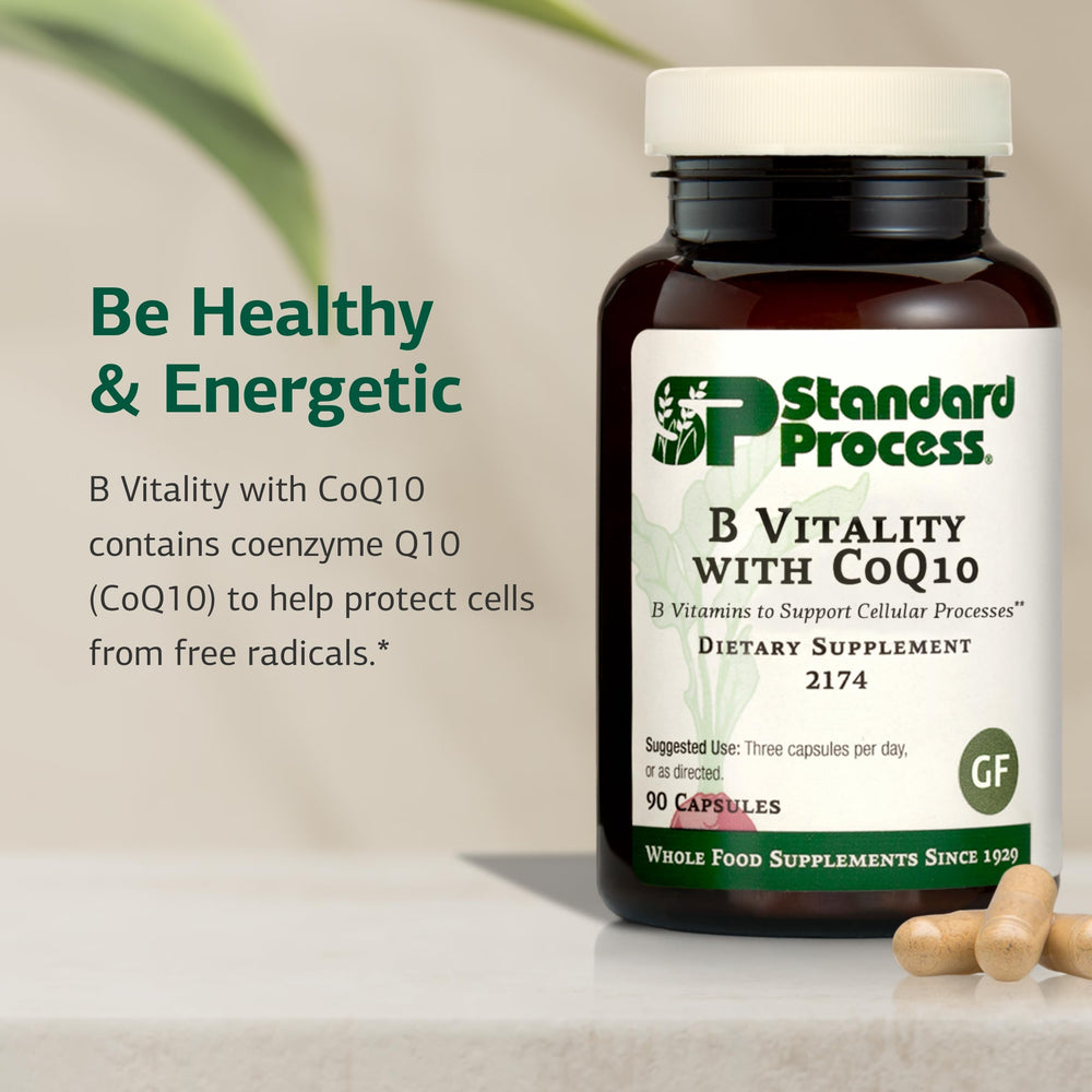 CoQ10 bottle pour shot with Standard Process B Vitality suggests convenient daily supplementation.