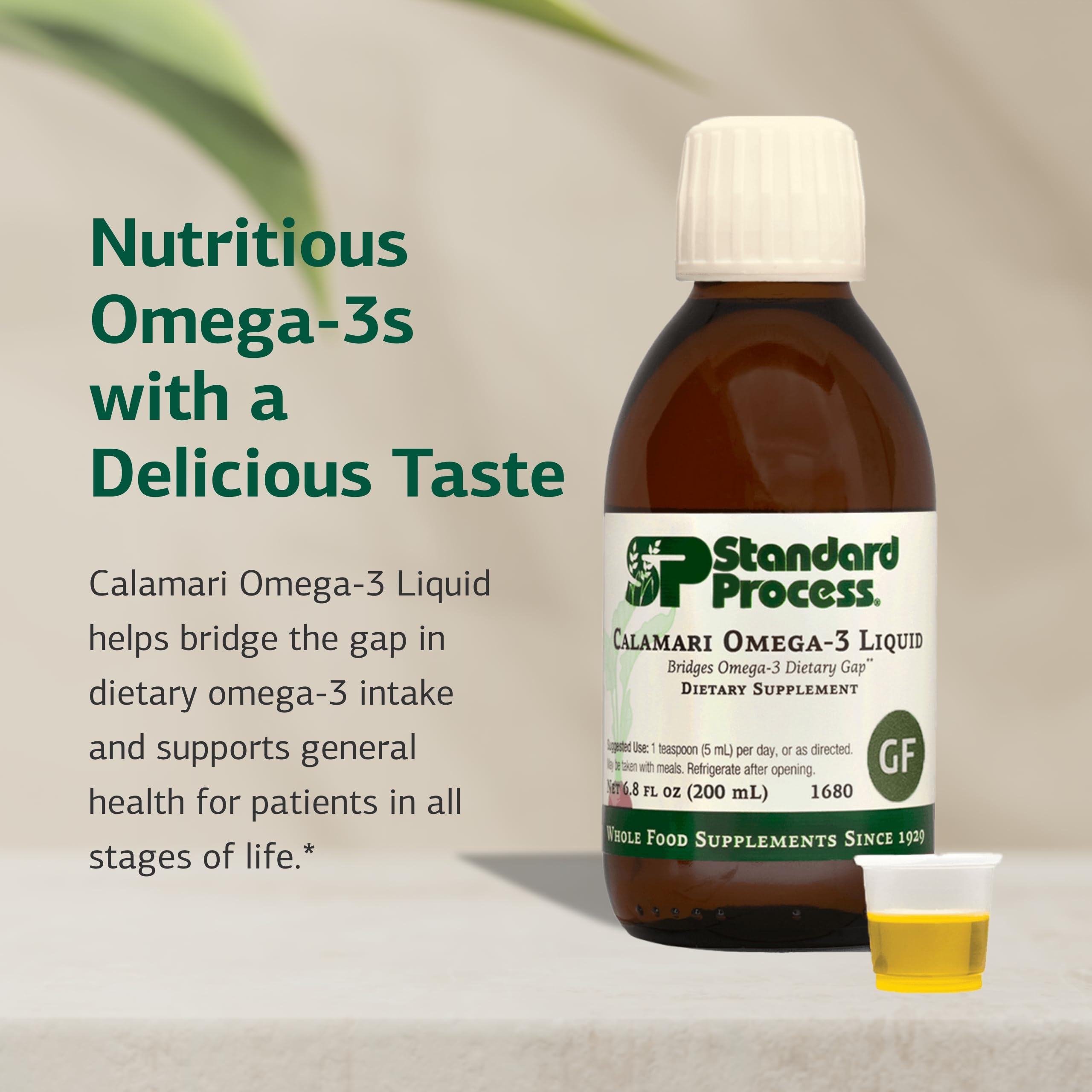 Standard Process Calamari Omega-3 Liquid poured into glass for easy daily use