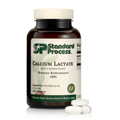 Standard Process calcium lactate tablets close-up for bone and muscle support.