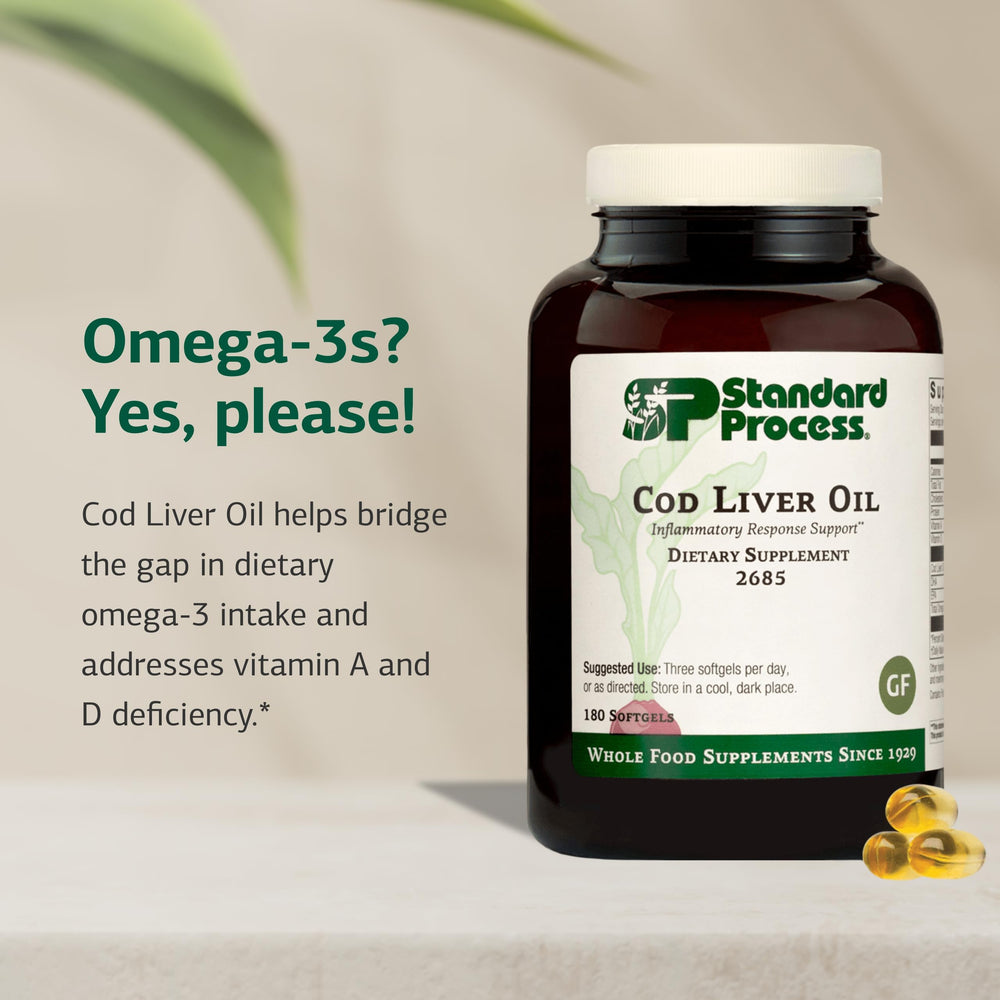 Standard Process Cod Liver Oil softgels pour demonstrating easy daily intake.