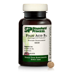 Standard Process Folic Acid B12-180 tablets bottle on table supporting nerve function