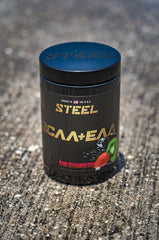 Pouring Steel Supplements BCAA EAA kiwi strawberry into a shaker