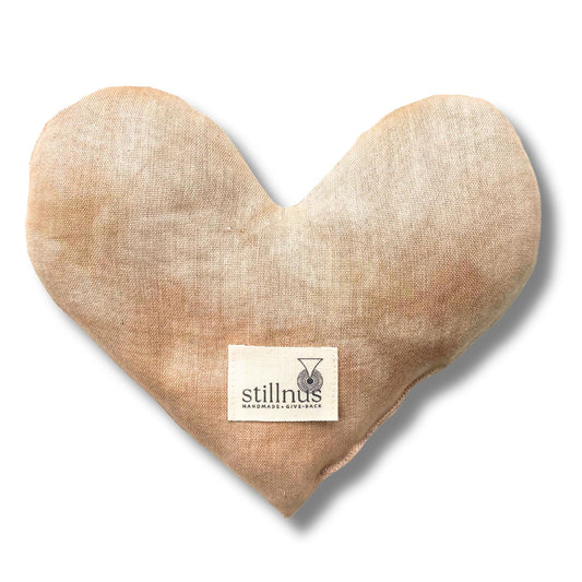 Stillnus heart eye pillow front view, handcrafted in calming earth tones for relaxation and meditation.