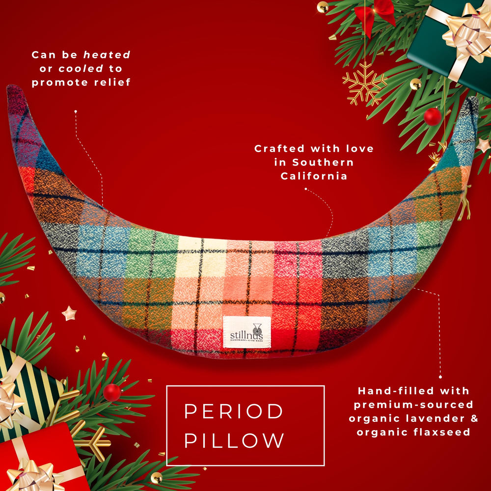 Close-up of rainbow tartan fabric on the Moon Comfort Pillow highlights soft, cozy texture.