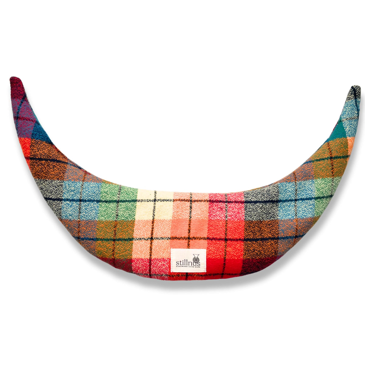 Stillnus Moon Comfort Pillow in Rainbow Tartan provides gentle neck support for relaxation.