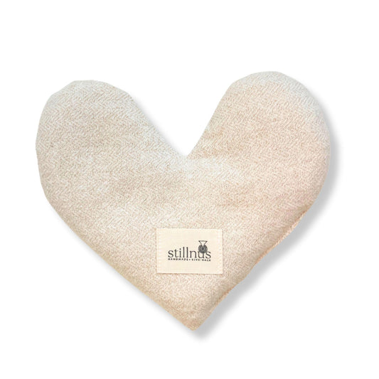 Stillnus weighted heart eye pillow with lavender detail for calming relaxation.