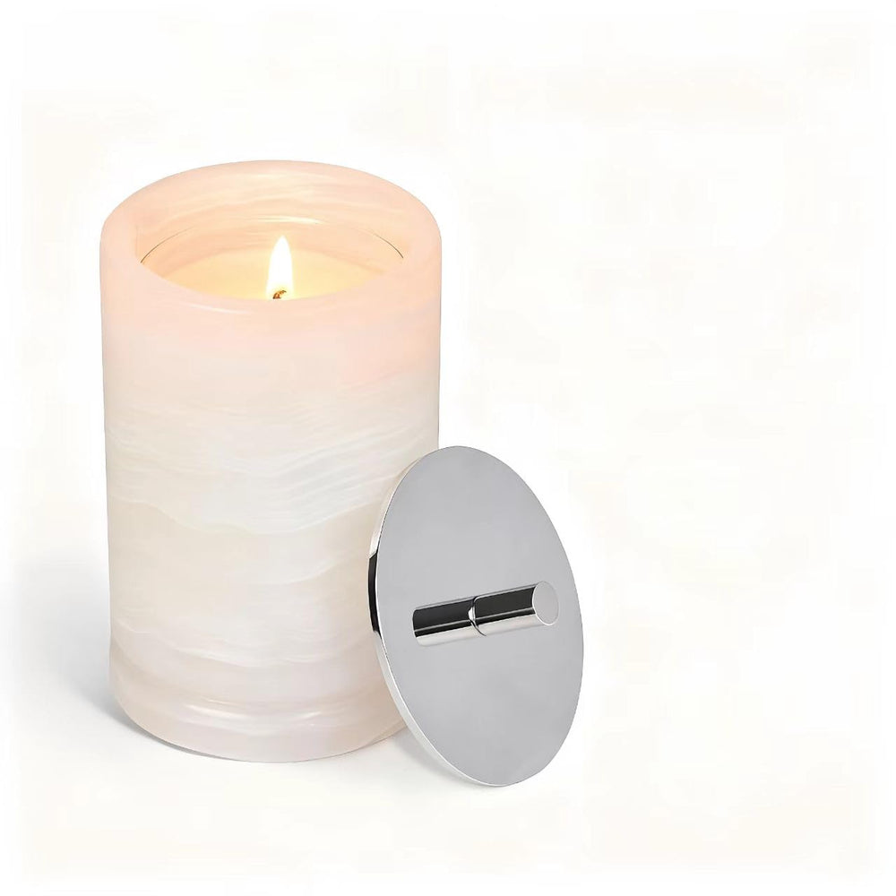 Story of Stone translucent candle in marble container for elegant ambiance.