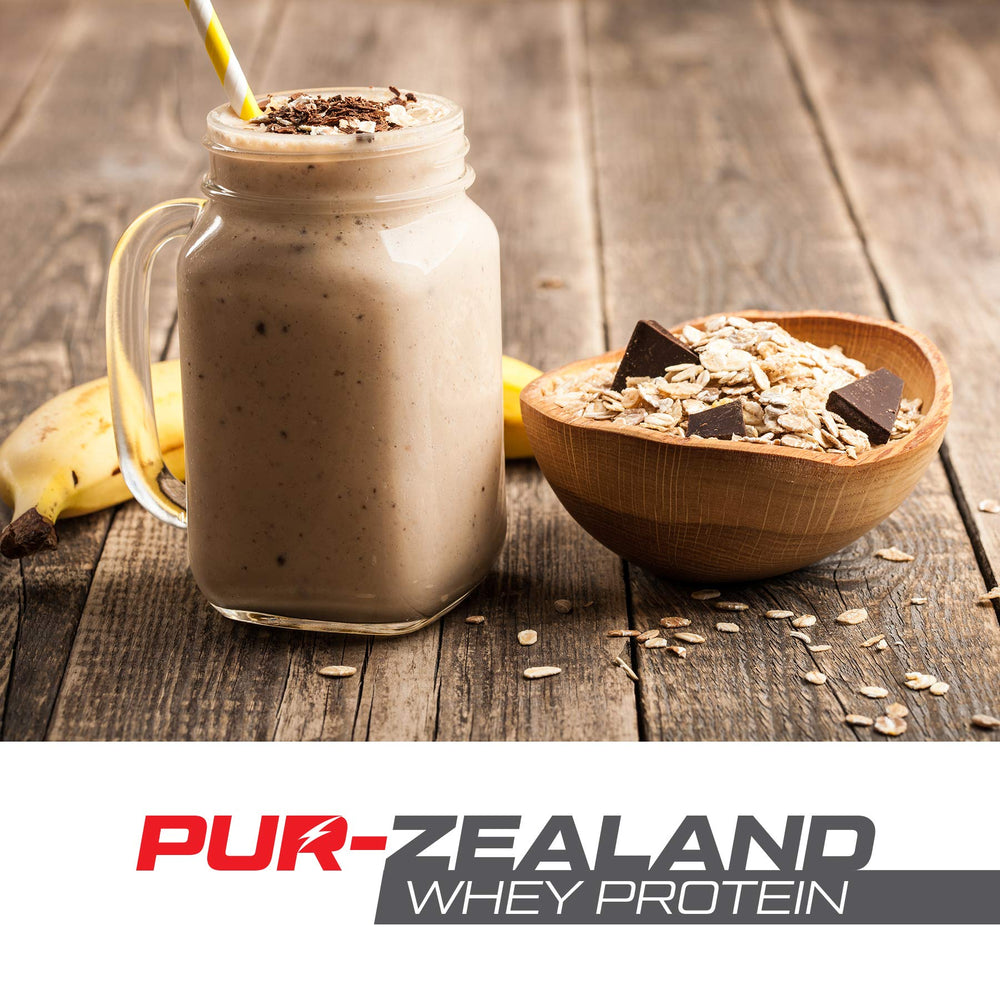 Strength Genesis Pur Zealander whey chocolate tub on kitchen counter