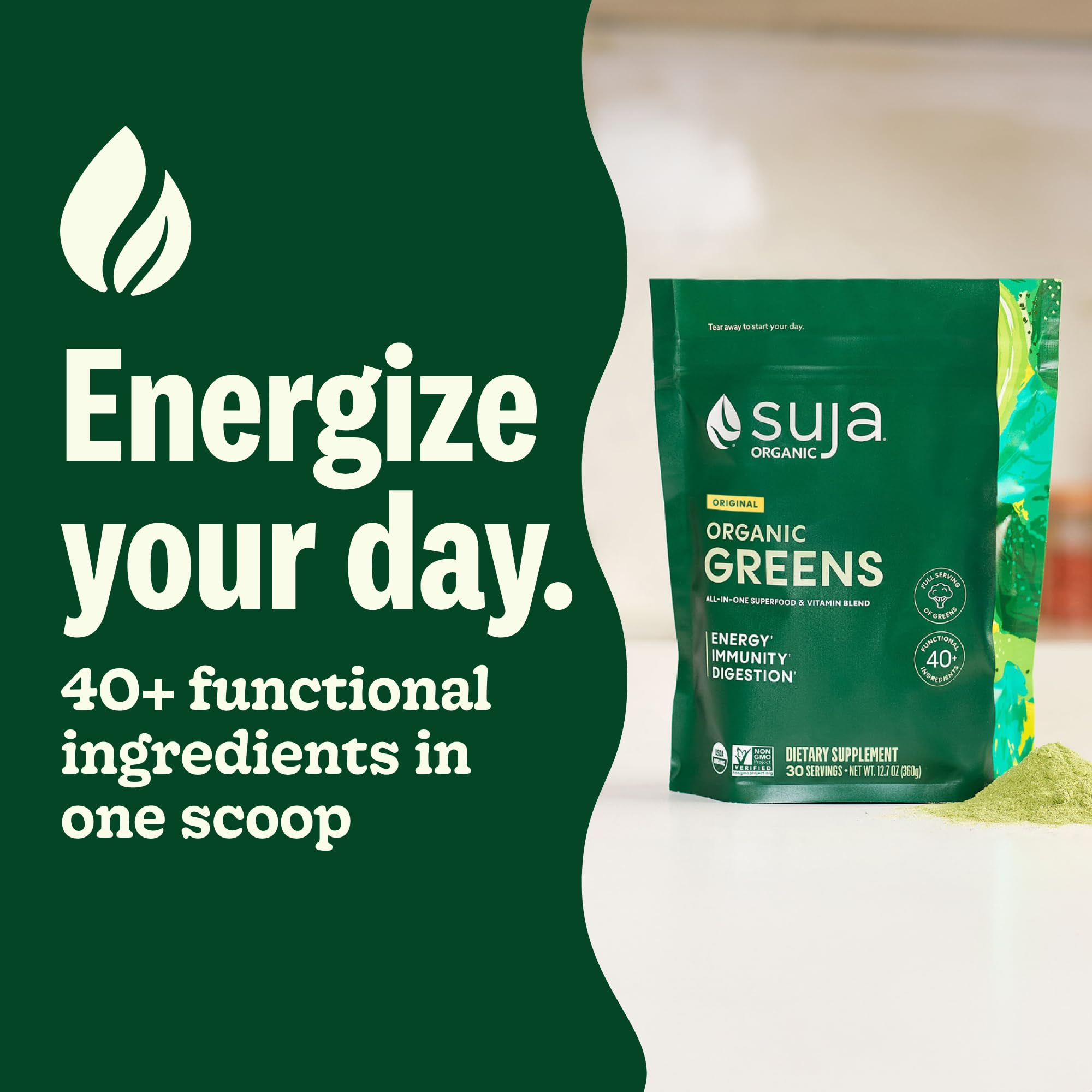 Suja Organic Greens powder scoop in cup ready to mix for nutrition.