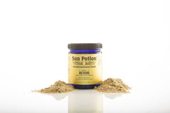 Close-up of powder texture suggests a fine, earthy aroma for tea or blends.