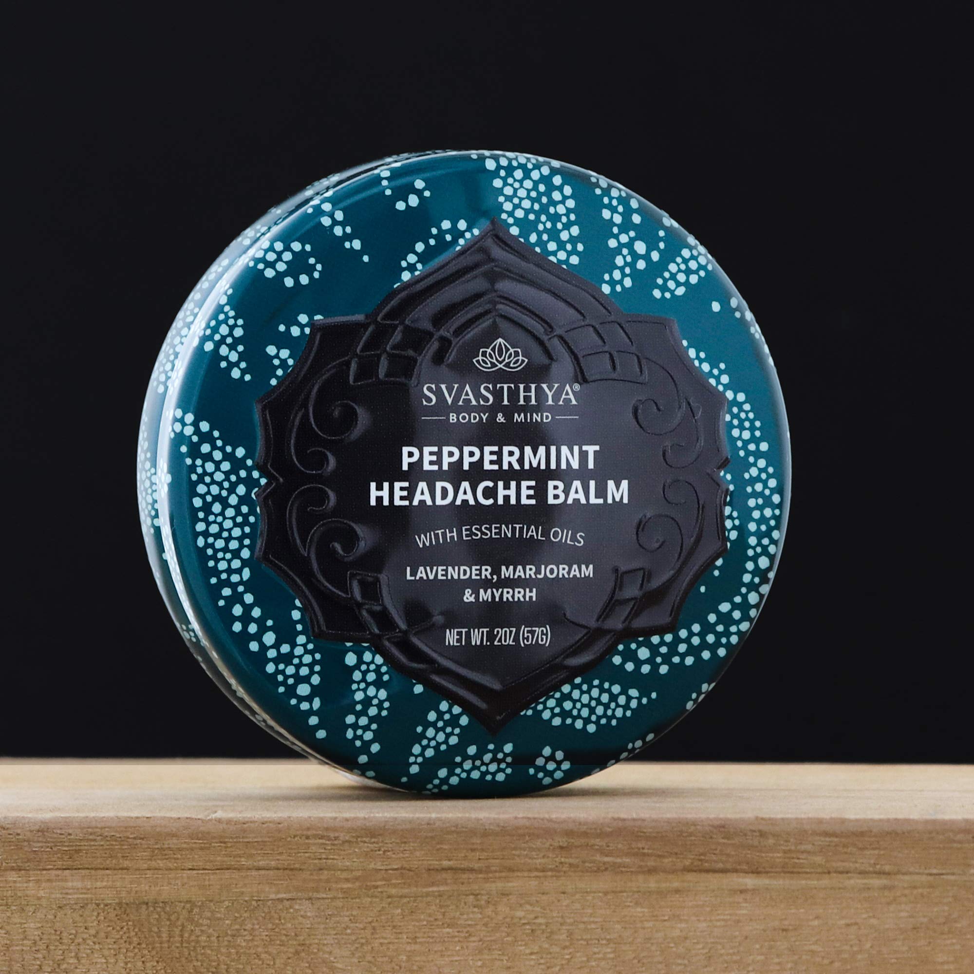 Svasthya Headache Balm applied to temples for a calming scent experience.
