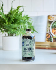 Sweet's Elderberry Shrub recyclable bottle icon highlights sustainable packaging.